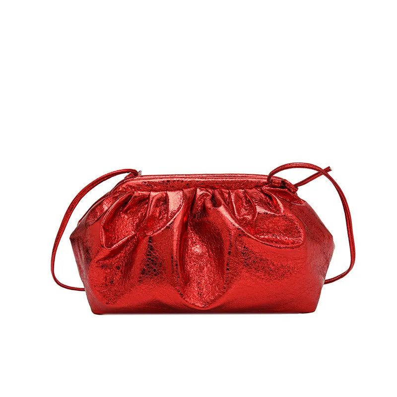 Simple hair clip fastening crossbody bag in shell shape, shown in rose red colour.