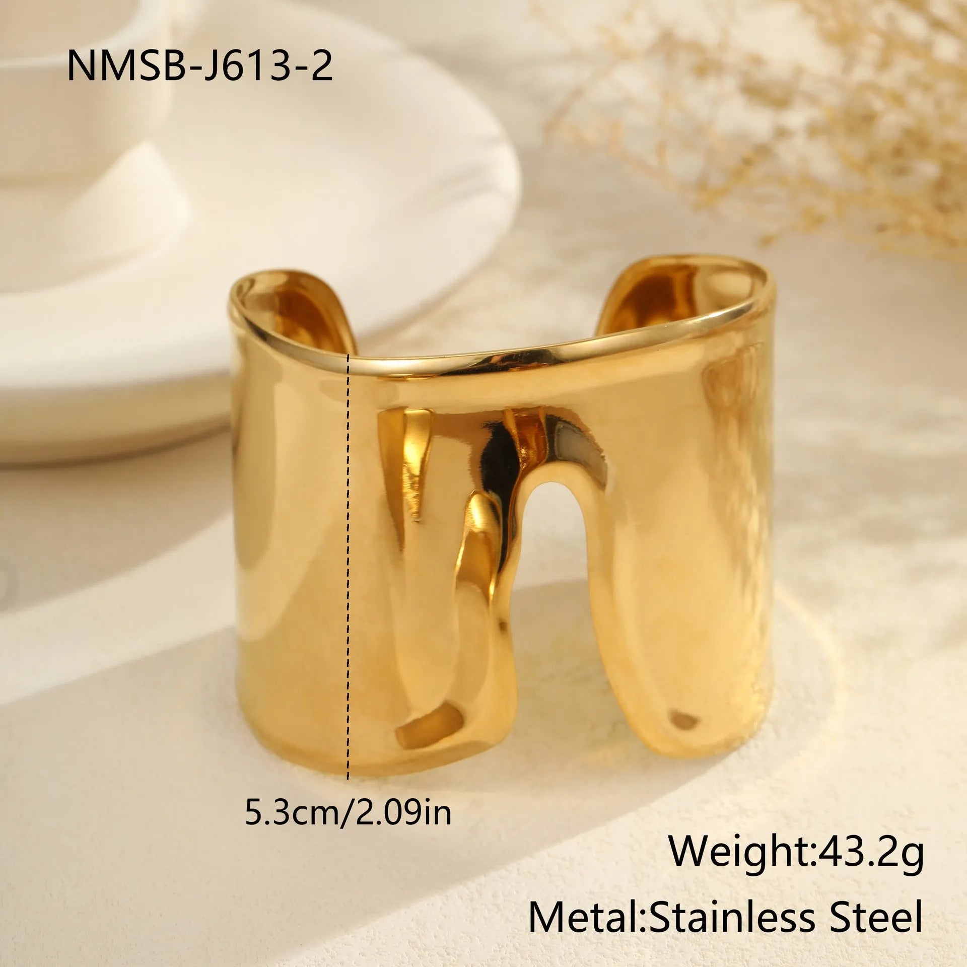 Women's exaggerated wide stainless steel bracelet with geometric wave design and niche opening in gold finish