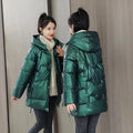 Women's loose thick hooded winter jacket in black, shown on a model.