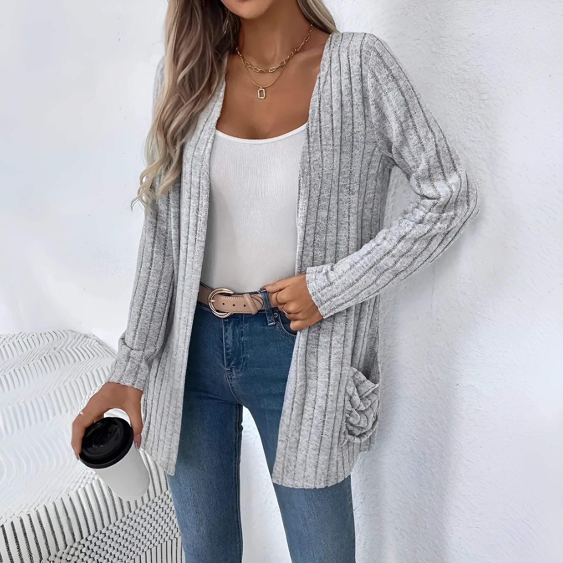 A loose-fit, solid colour long sleeve cardigan for women with a chest pocket, shown in grey and black.