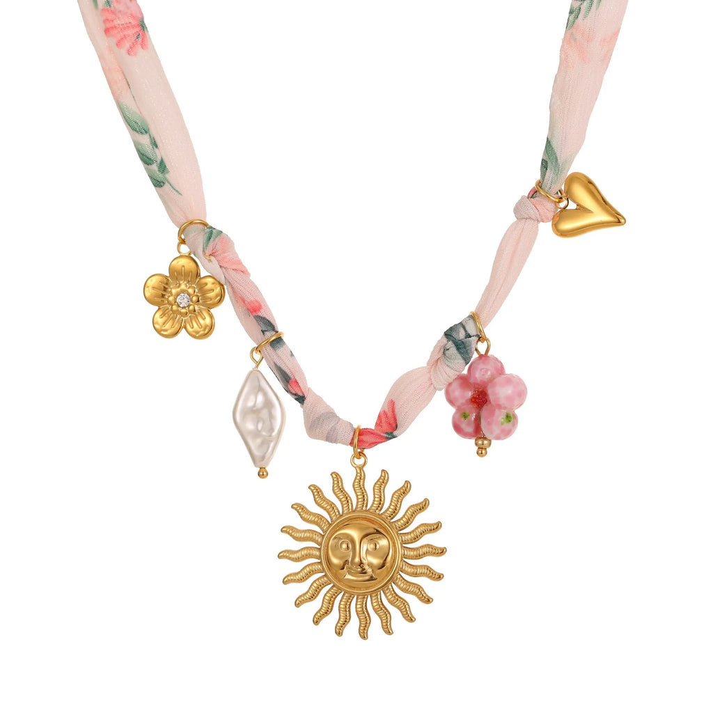 Women's stainless steel sun pendant necklace with adjustable chain and 18K gold electroplated finish