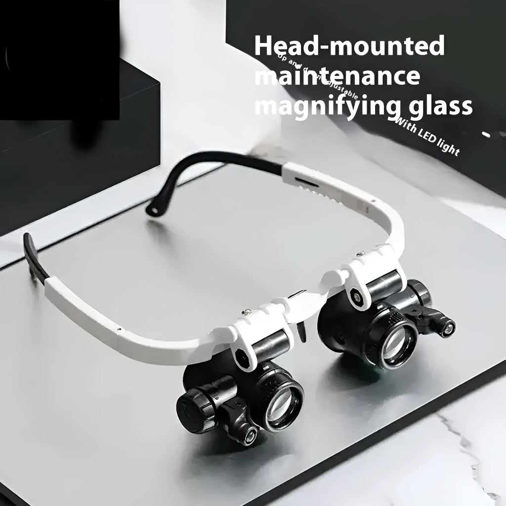 White head mounted magnifying glass with LED light, shown in unfolded position for use on a workbench.
