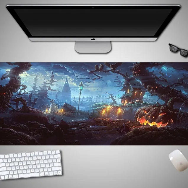 Oversized Halloween-themed computer mouse pad with non-slip rubber cloth base on a desk