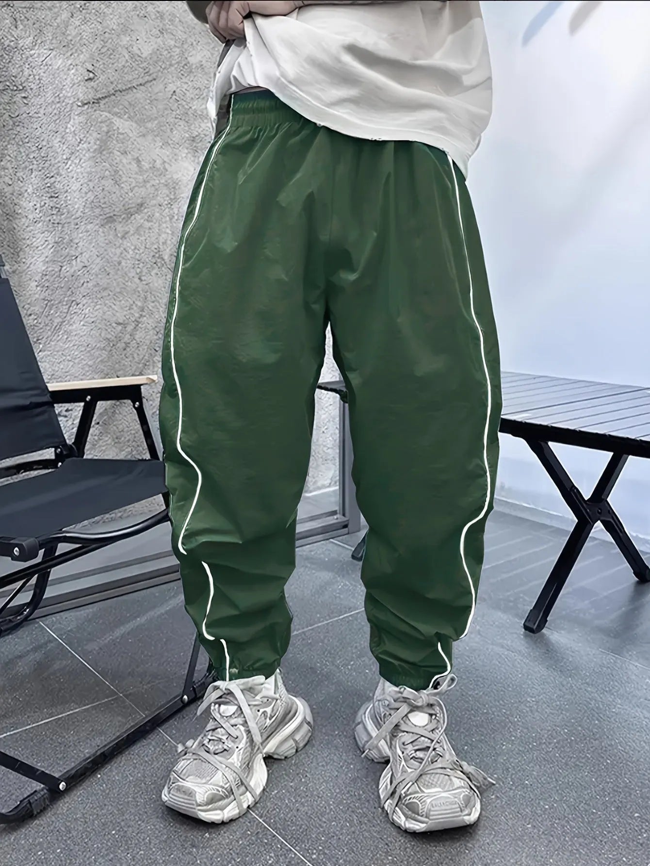 Men's loose-fit cropped casual trousers in bamboo fabric, shown in Army Green colour.