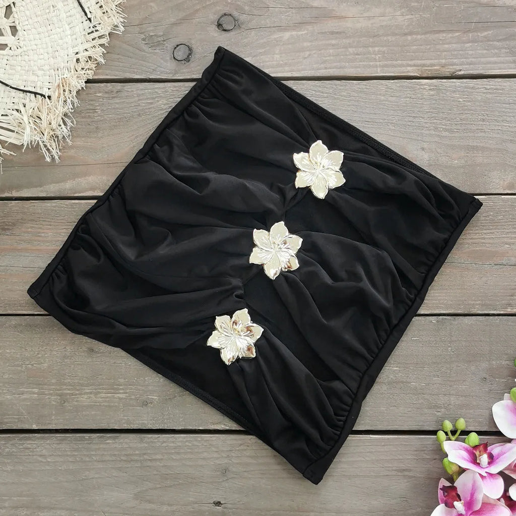 Solid colour high-waisted one-piece swimsuit with hollow-out tube top and matching short skirt for women.