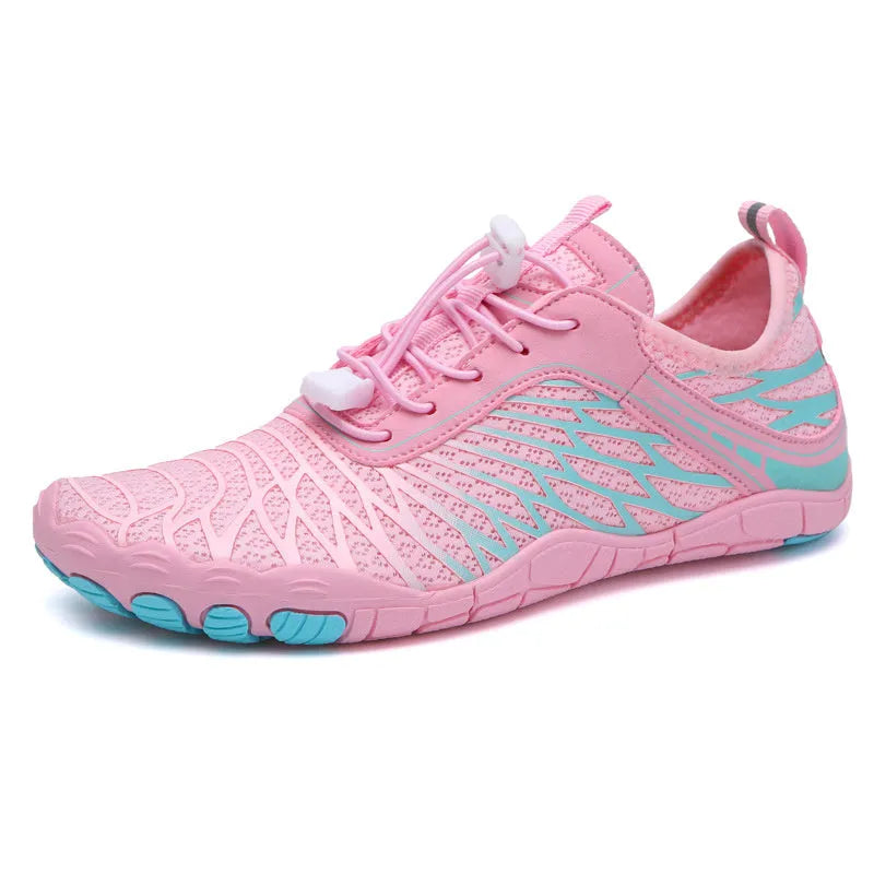 White and pink lace-up sports shoes with a breathable gauze lining and textured rubber outsole.