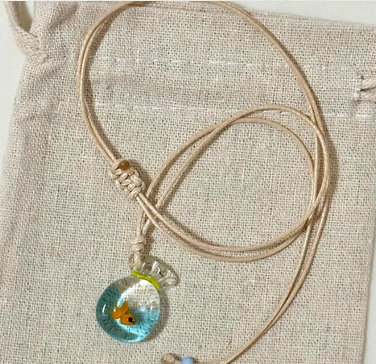Women's coloured glaze pendant necklace with cotton linen chain featuring Skirt Everyday Joker design
