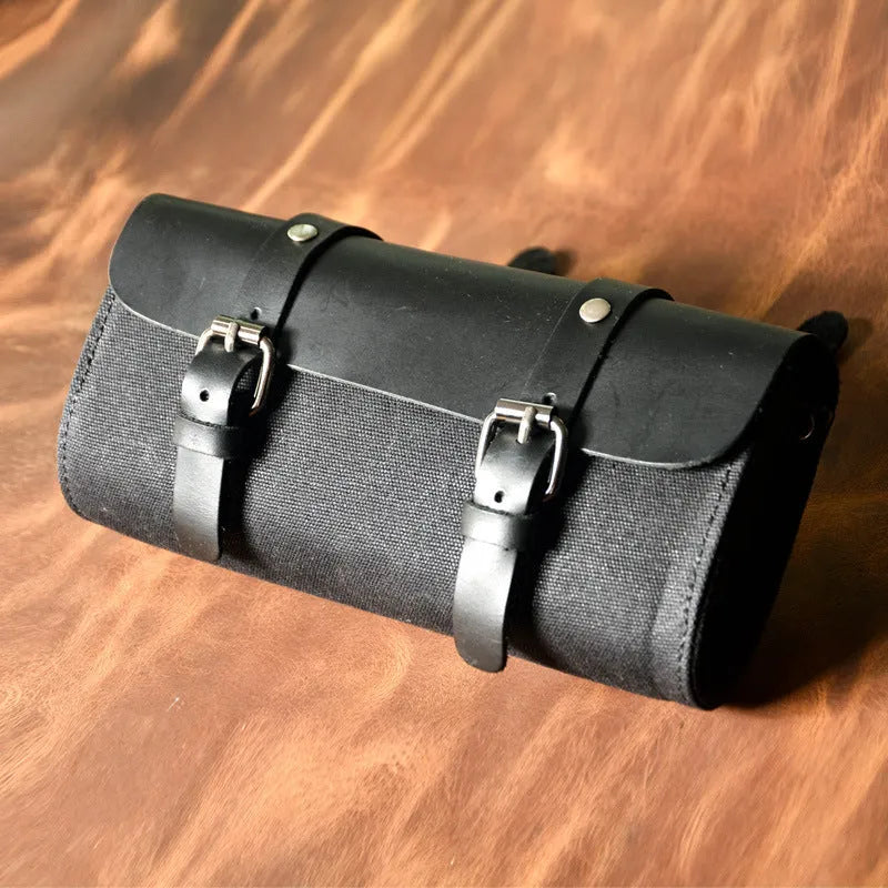Cotton retro-style messenger bag showing internal organiser pockets and rivet detailing.