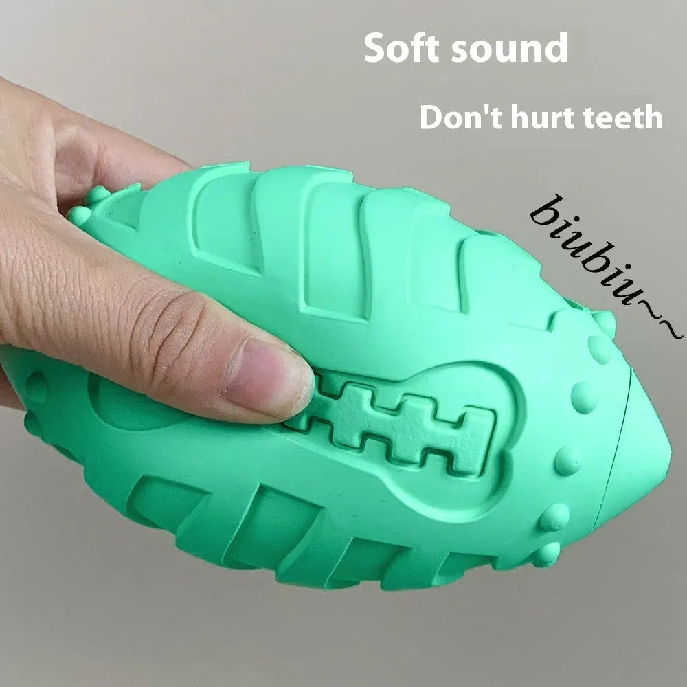 Light green rubber rugby ball dog toy with textured surface for teeth cleaning
