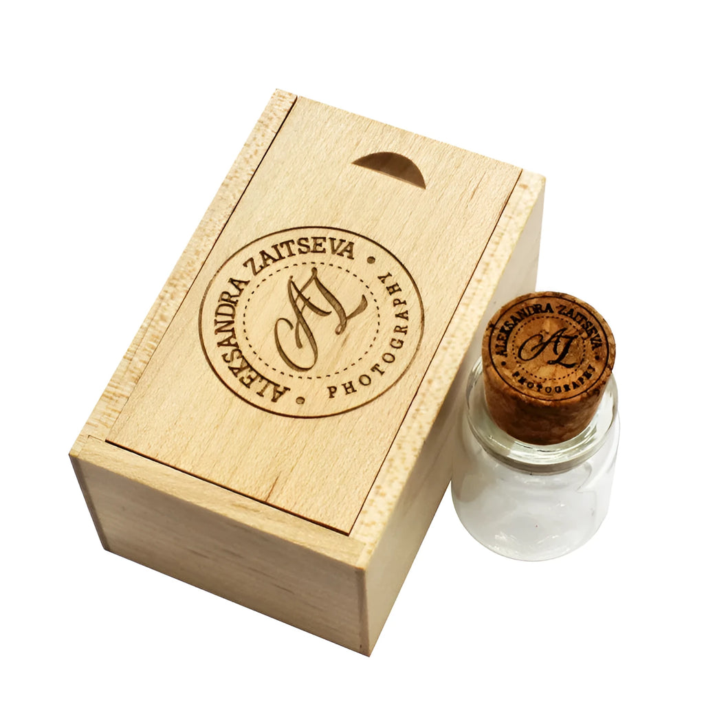 Personalised wooden drift bottle-shaped USB flash drive showing custom graphic on its side.