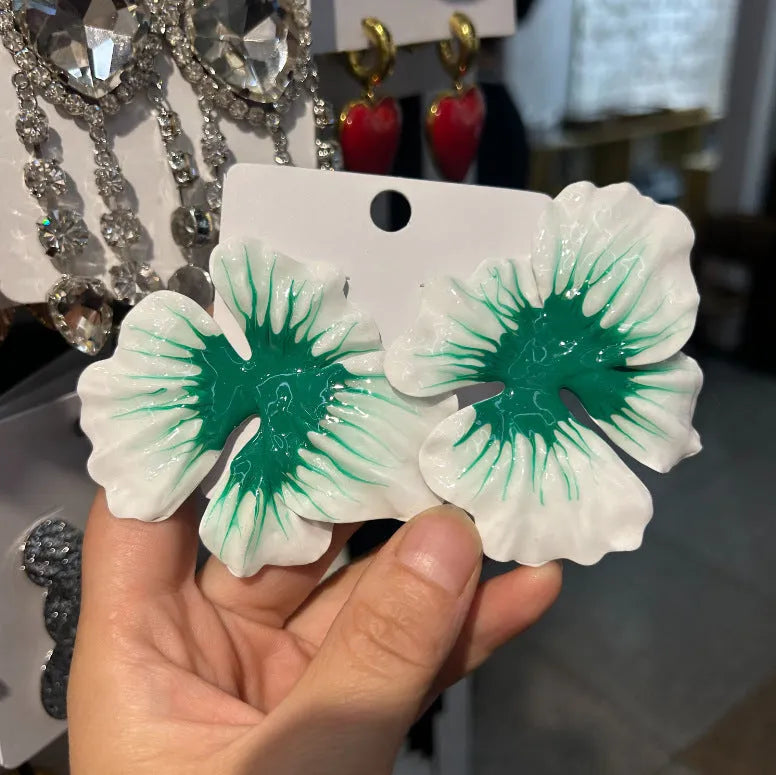 Women's alloy floral stud earrings with oil-spot glaze finish in blue, green, purple, and rose colour options