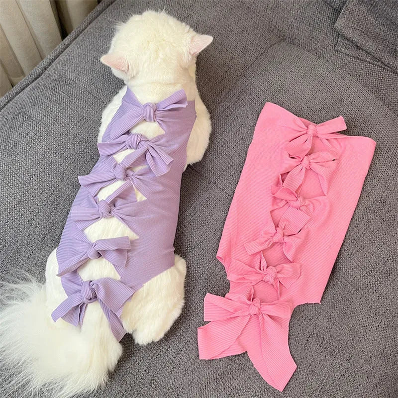 Lace-up polyester cat sterilisation recovery garment shown in blue, brown, green pineapple, pink, or purple