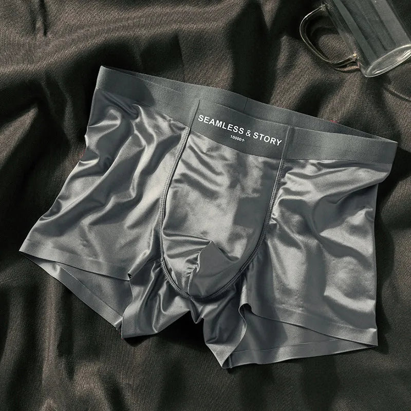 Men's ice silk satin boxer shorts on a white background, showing mid-waist design.