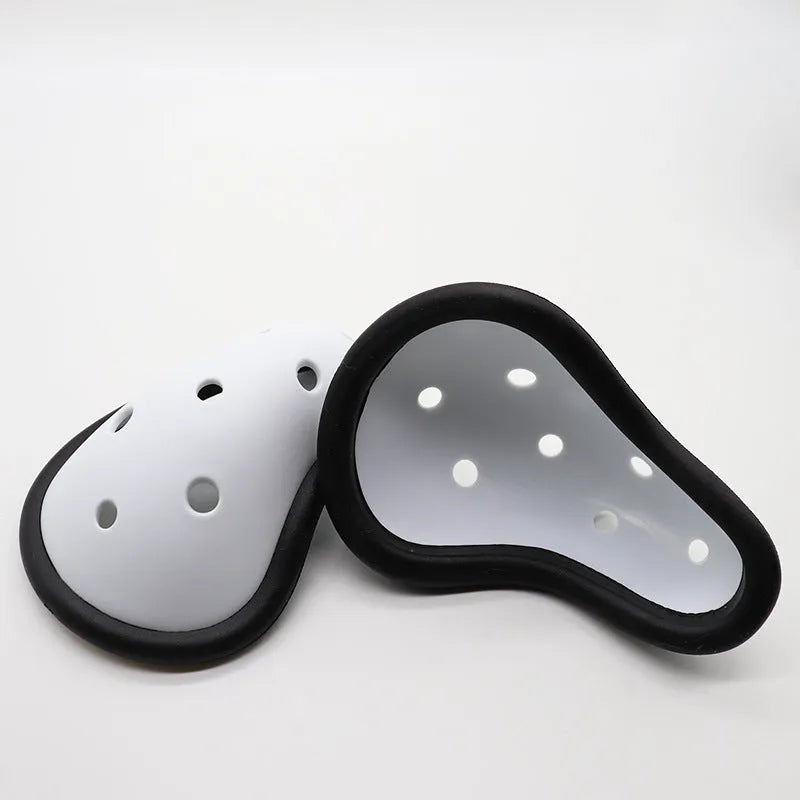 Rubber genital protector for adult and child sports safety in hockey, rugby, and martial arts.