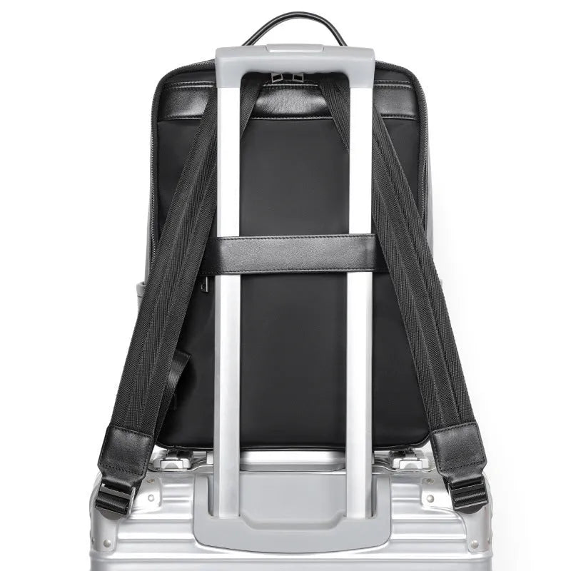 Men's black genuine leather computer backpack with 36-55L capacity and physiological curve back plate