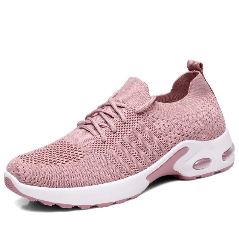 Women's black casual sneakers with mesh upper, lace-up front and soft PVC sole