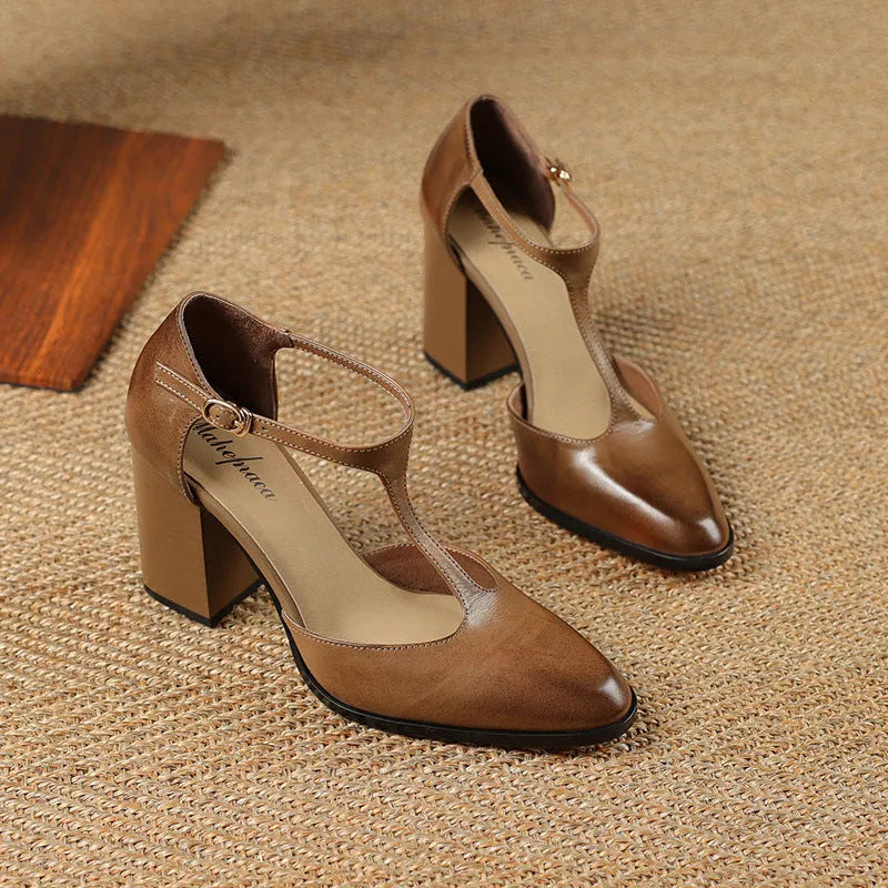 Women's dark brown hollow-out pointed toe buckle heels made from genuine cowhide leather.