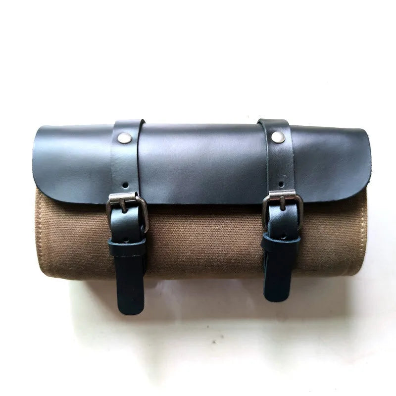 Cotton retro-style messenger bag showing internal organiser pockets and rivet detailing.