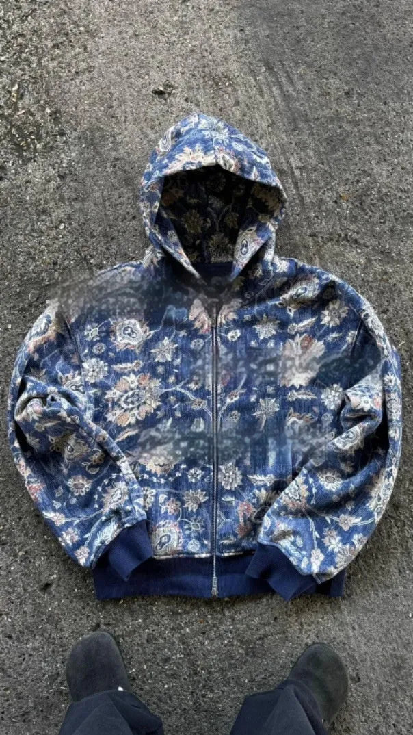Man wearing a blue loose-fit hooded zip coat with digital print, long sleeves, for casual autumn wear.