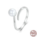 Sterling silver adjustable pearl ring with natural shell pearls on open loop design
