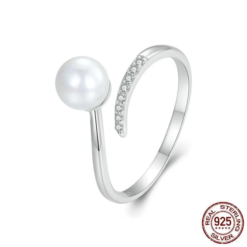 Sterling silver adjustable pearl ring with natural shell pearls on open loop design