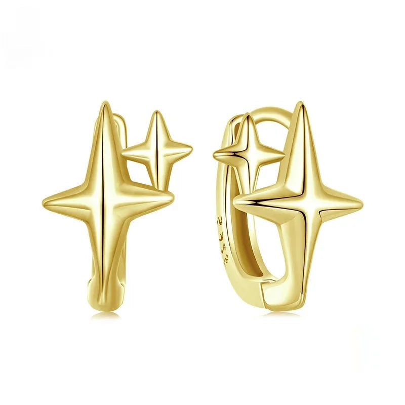 Minimalist sterling silver star ear clips with oxidised finish and ear clip design