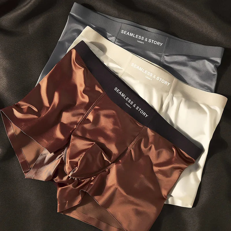 Men's ice silk satin boxer shorts on a white background, showing mid-waist design.