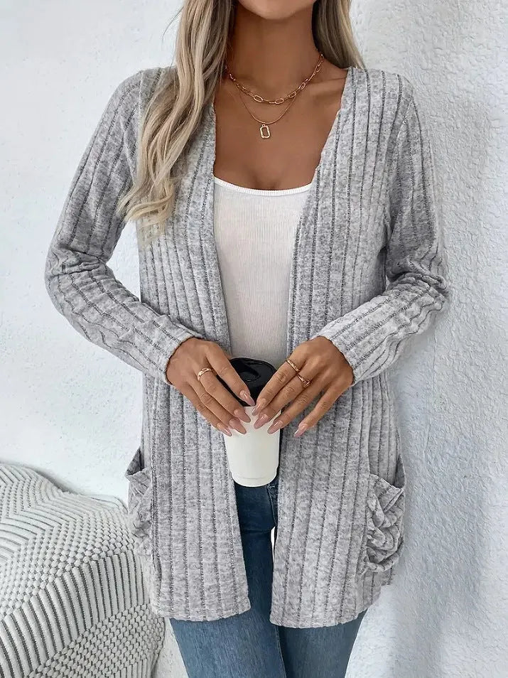 A loose-fit, solid colour long sleeve cardigan for women with a chest pocket, shown in grey and black.