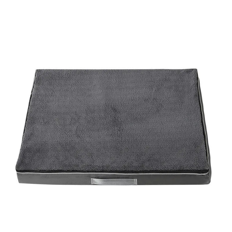 Removable washable sponge dog mat in brown, available in multiple sizes on a wooden floor.