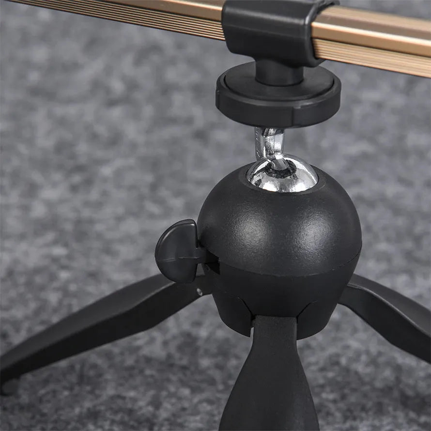 Aluminium alloy triangular ice fishing rod holder bracket supporting a small fishing rod on ice