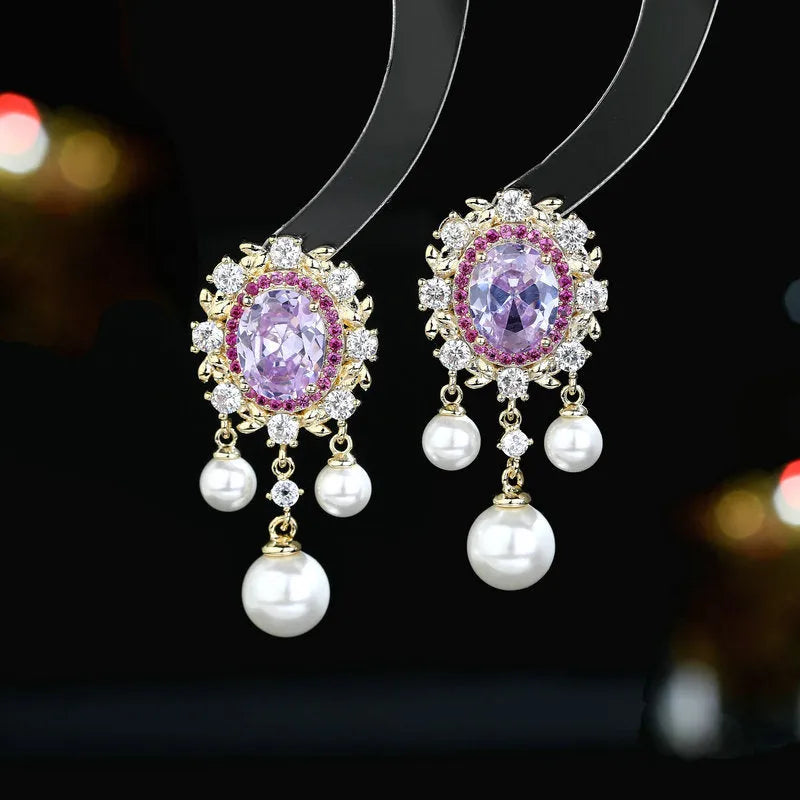 Oval zircon inlaid pearl tassel earrings in copper with geometric design and dangling elements