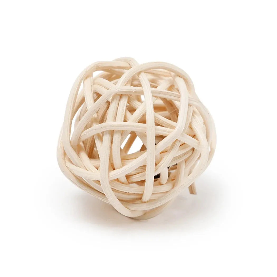 Two cat toys: hollow rattan ball and faux feather ball with bell on primary coloured background