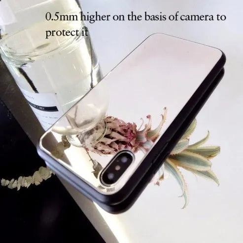 Black iPhone mirror phone case showing reflective glass back, compatible with multiple iPhone models.