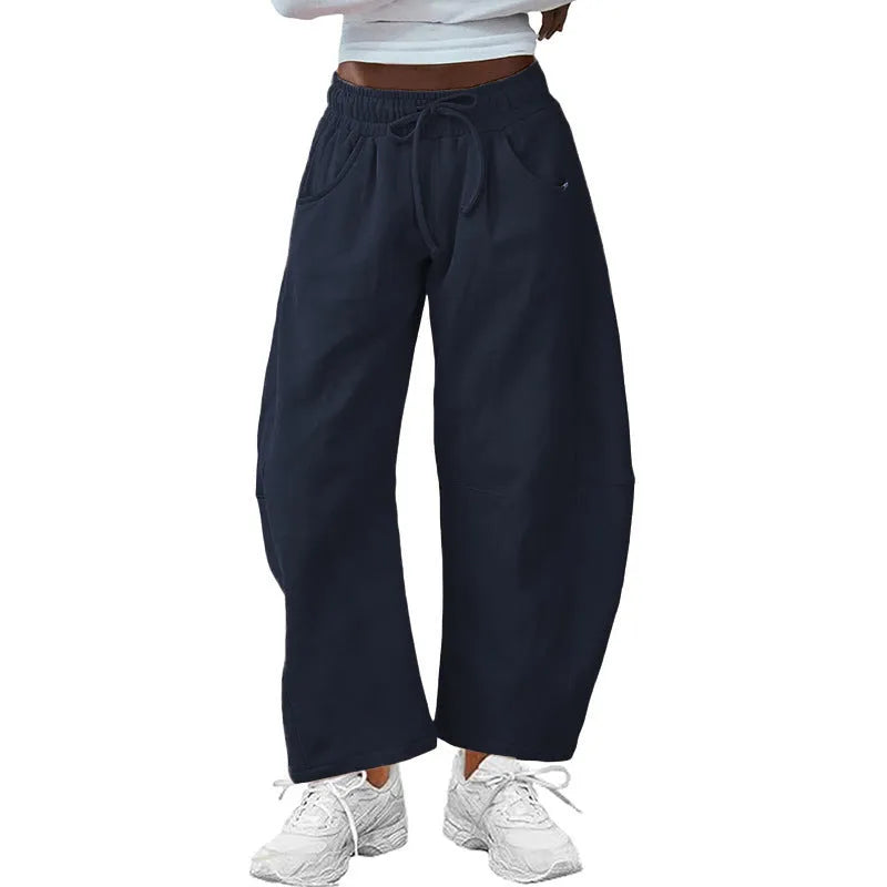 Loose cropped sweatpants with drawstring waist and side pockets in European street style