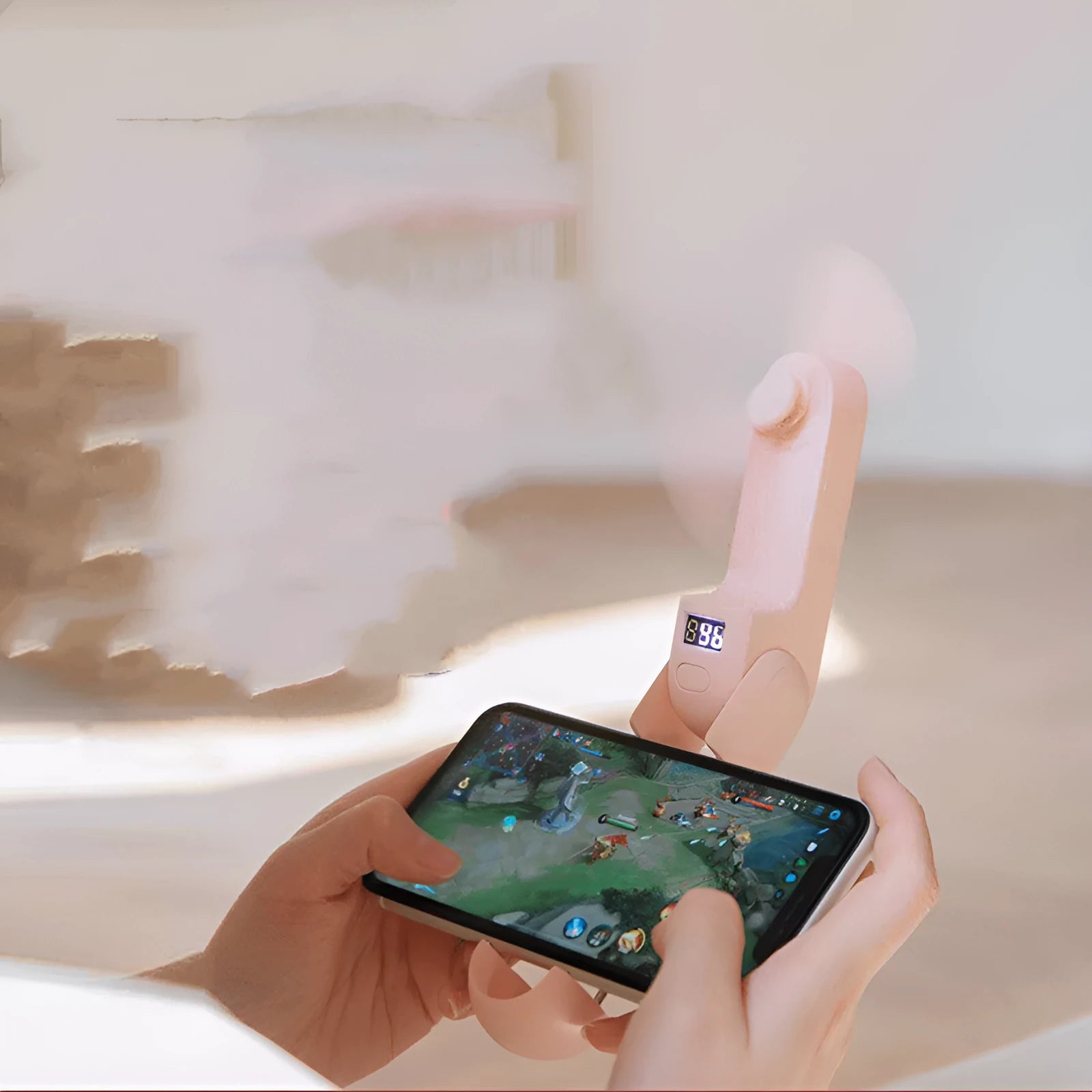 Green folding handheld mini fan with USB charging cable