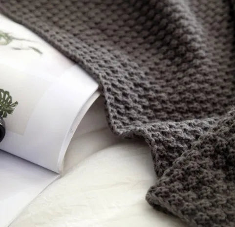 Nordic fringed knit ball acrylic blanket in beige colour showing texture detail and 130x170cm size
