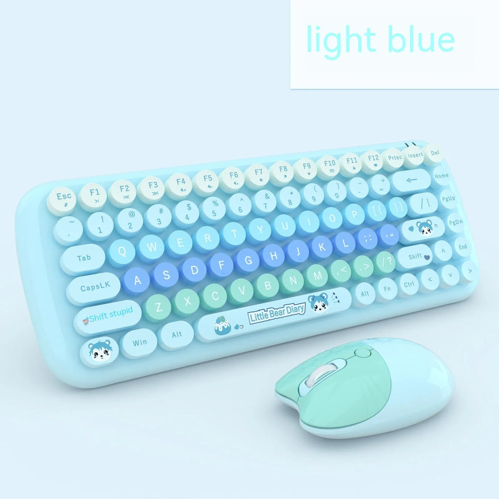 Pink mini wireless keyboard and mouse set with compact design on a desk