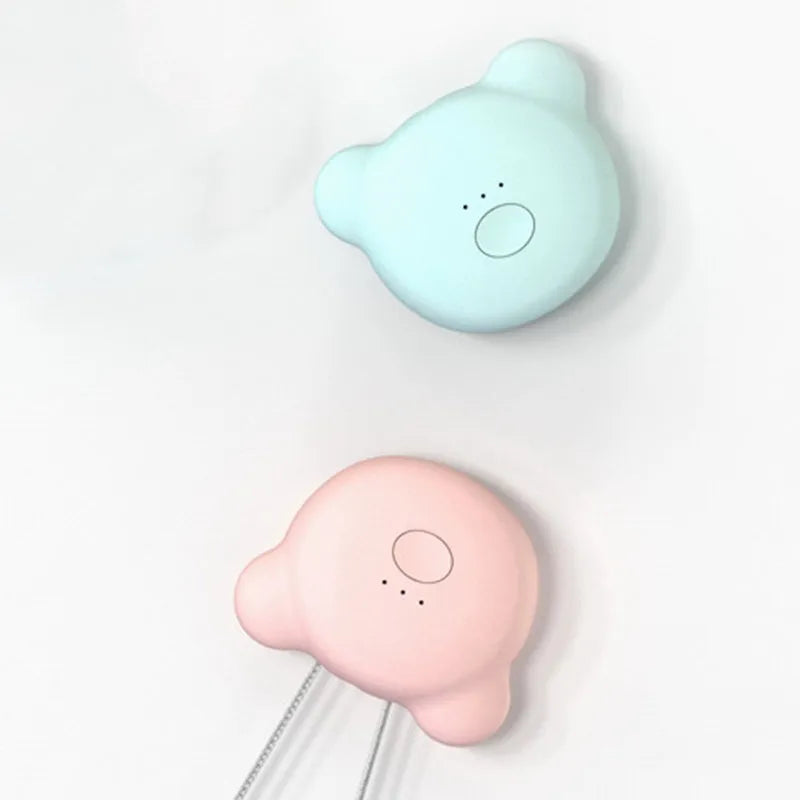 Mini USB air purifier necklace in pink showing compact wearable design with one-button control