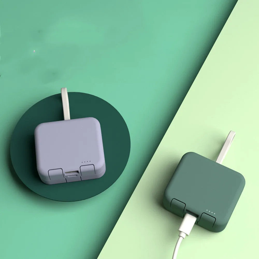 Handbag back clip power bank in blue showing USB-A and Type-C ports and integrated phone stand function.