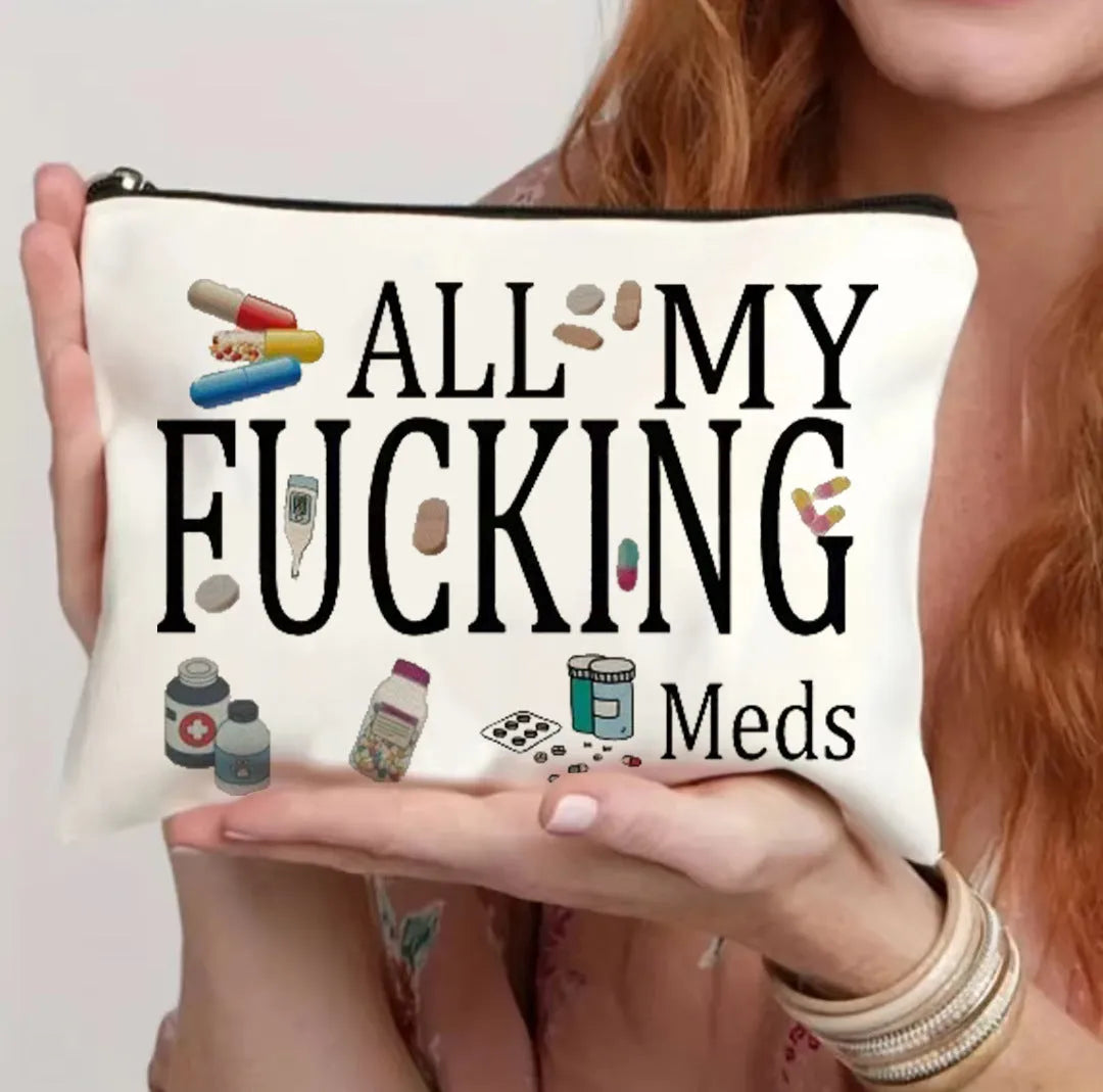 Canvas-style polyester cosmetics bag with a zipper, shown in multiple colour options.