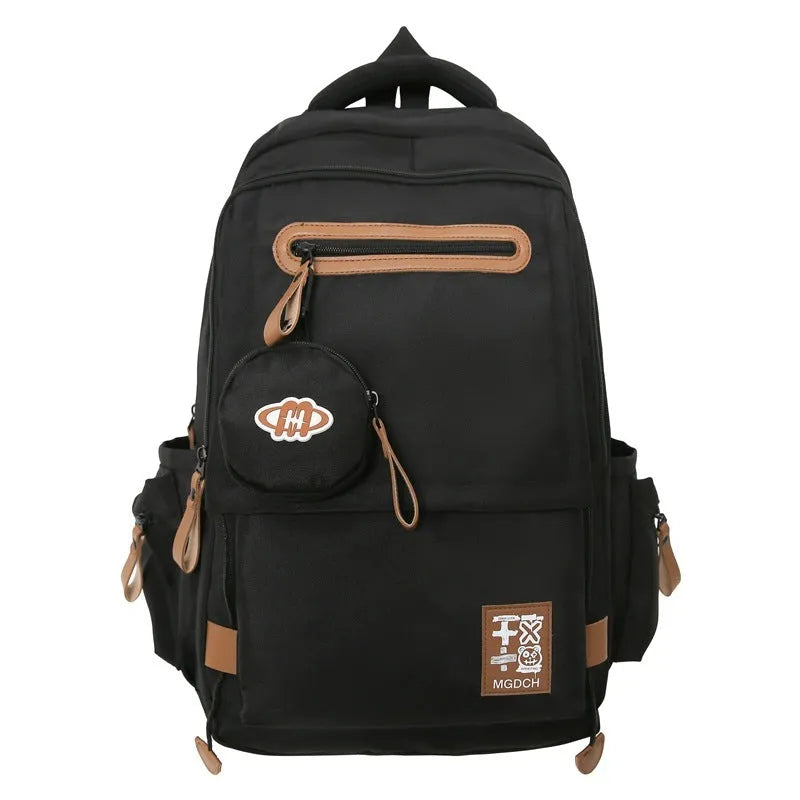 Large black nylon backpack for school with curved shoulder straps and sewing line detail
