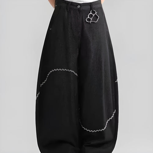 Black straight-leg denim trousers for teenagers on a hanger, showing mid-waist and zip fly detail.