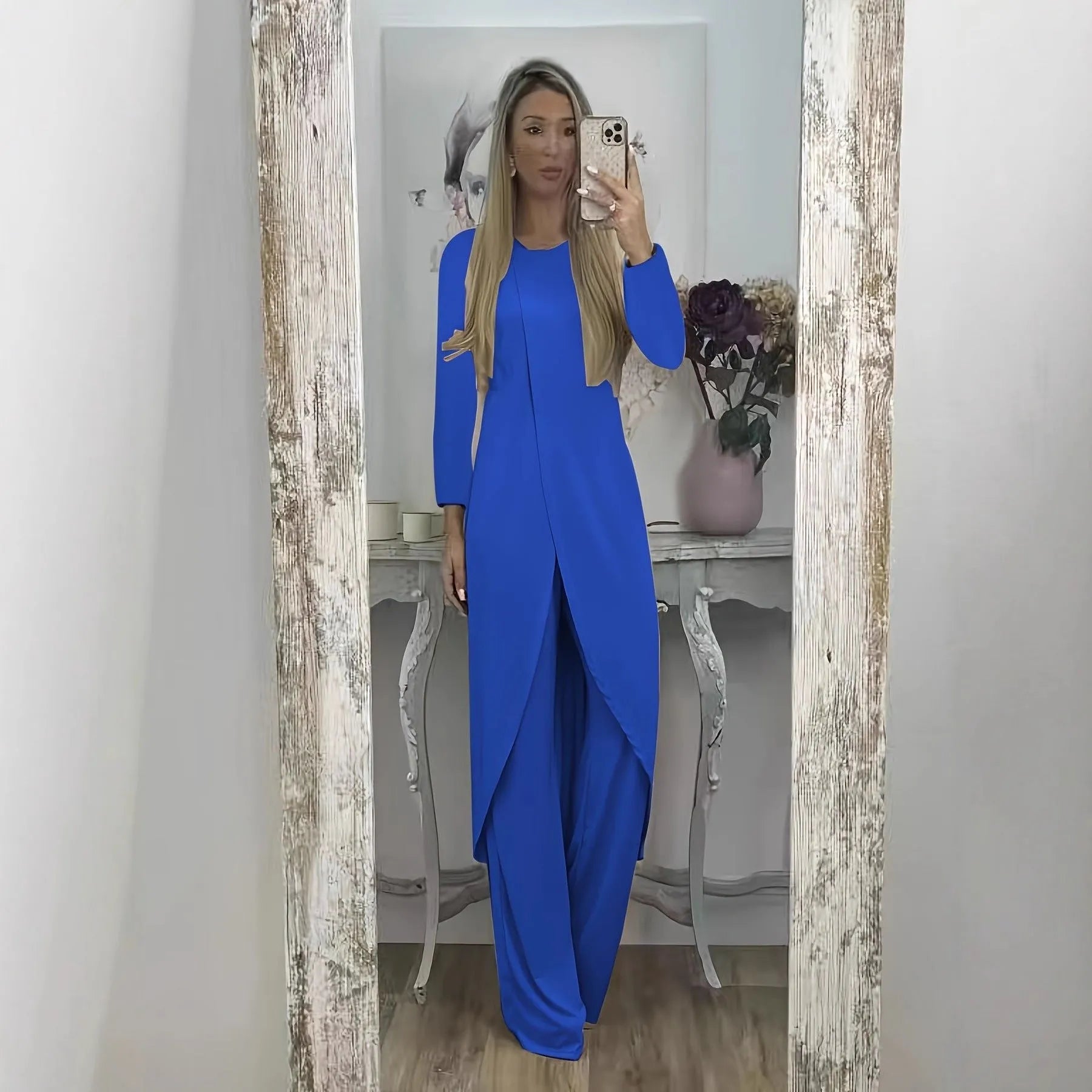 Casual loose-fitting long sleeve top and trousers lounge set in polyester.