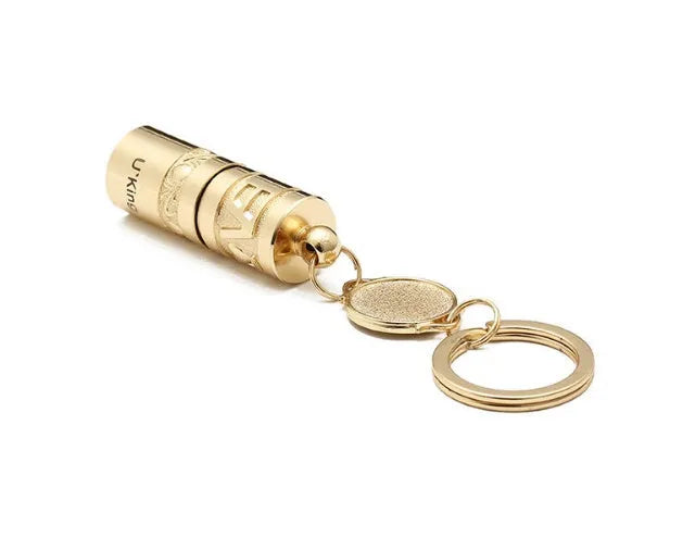 Gold zinc alloy waterproof LED flashlight attached to a keychain.