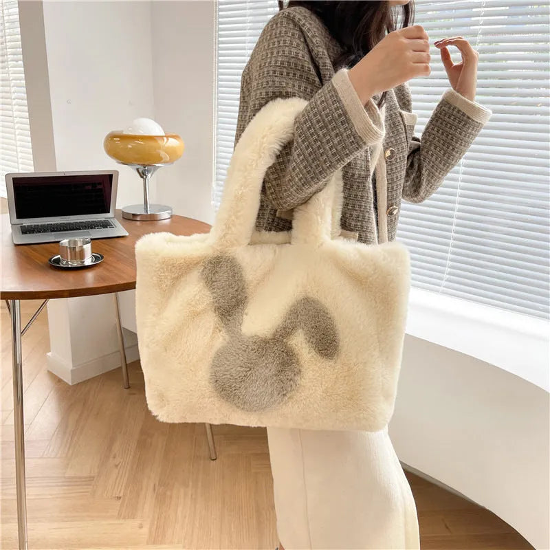 Plush shoulder bag with cartoon rabbit ears detail in solid colour