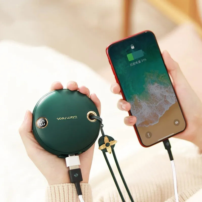 Green hand warmer power bank with digital display showing 5000mAh capacity and heating function