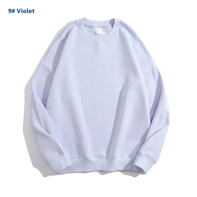 A loose round neck off shoulder pullover sweater in a solid colour, with long sleeves.