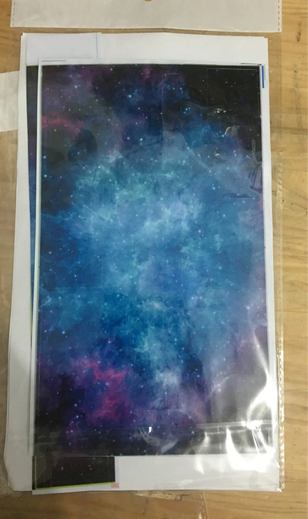 Blue Xbox One film skin sticker with matte finish shown alongside OPP bag packaging