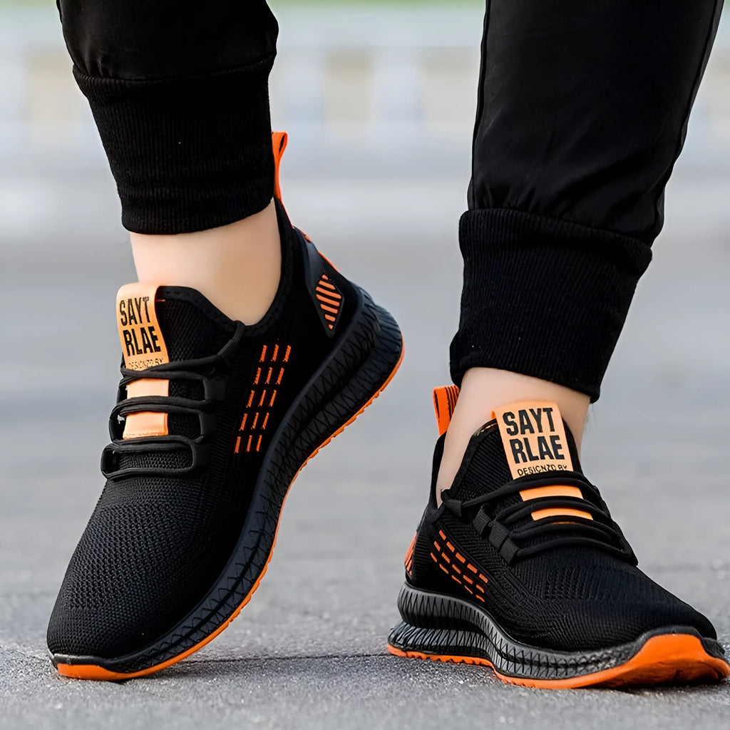Men's black casual sports shoes with Flying Weave upper and flat low-heel profile.