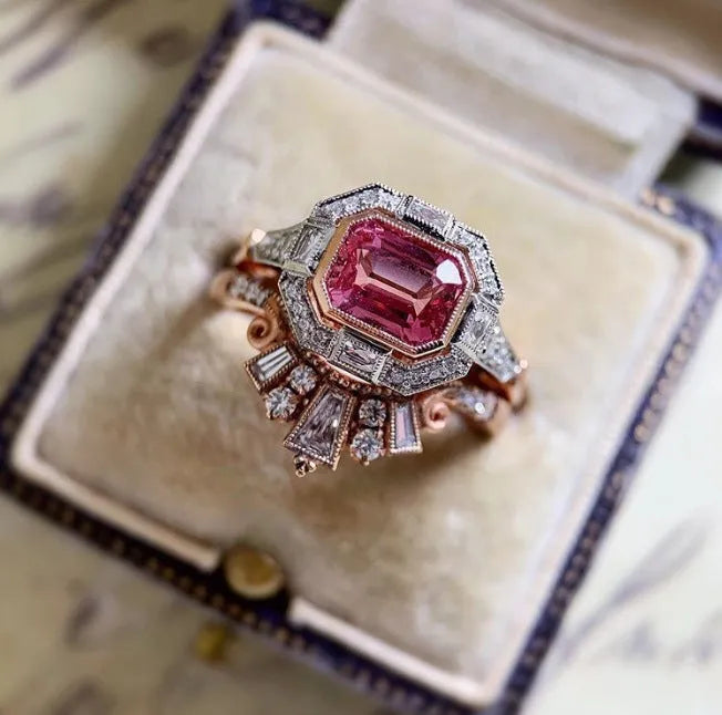 Rose gold geometric women's fashion ring with ruby-style detail in retro design.
